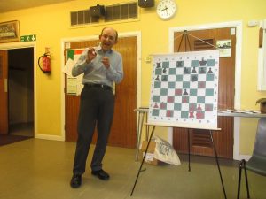 Matthew explains the theme of compactness while demonstrating Capablanca-Sergeant Hastings 1929. Photo by kind permission of Richard James 